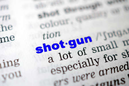 Closeup page with text SHOTGUN in colored highlighの写真素材