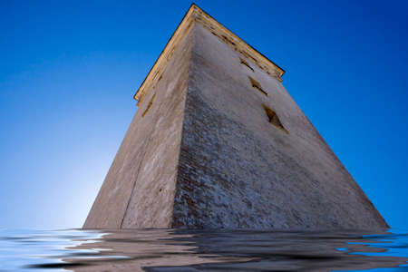 Lighthouse Rubjerg Knude sinks into the sea in Denmarkの写真素材