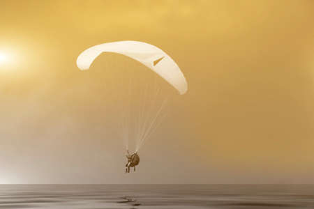 Paragliding in the sunset in Denmark near Løkkenの写真素材