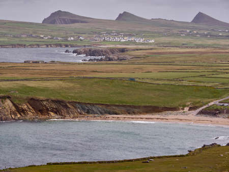 The Irish West coast near Clogher, Dingle, on a stormy and cloudy day. The Three Sisters can be seen...