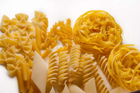 Italian dry raw pasta.Set of fusilli penne, tagliatelle, bow tie and macaroni bronze drawn white...
