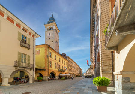 Cuneo, Piedmont, Italy - October 6, 2021: The civic tower (14th century) 52 meters high, in via Roma...