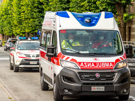 Savigliano, Cuneo, Italy - September 2, 2021: Ambulance of the Italian Red Cross with following car...