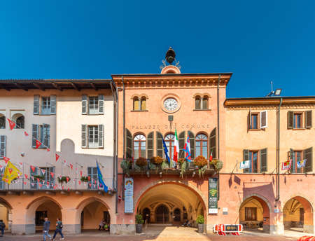 Alba, Cuneo, Piedmont, Italy - October 12, 2021: town hall with the banners of the districts of the donkey race (Palio degli Asini) at the time of the Alba truffle fairのeditorial素材