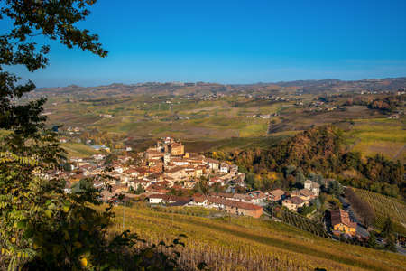 Panorama on Barolo Village, Cuneo, Italy, among the autumn colored vineyards on the Langhe hills