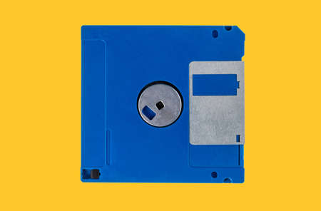 Blue Floppy disk isolated on yellow background, clipping path