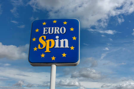 Fossano, Italy - November 24, 2021: Sign of an Eurospin italian supermarket against the blue sky...