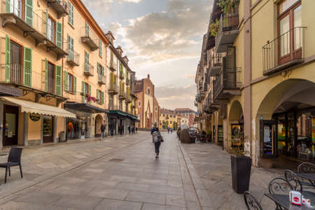 Saluzzo, Cuneo, Italy - October 19, 2021: Corso Italia, main pedestrian street with Maria Vergine...