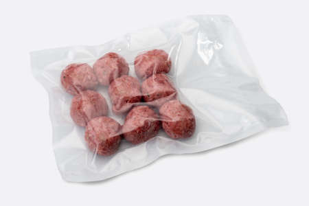 Meatballs in vacuum packed sealed for sous vide cooking, isolated on white, top viewの写真素材
