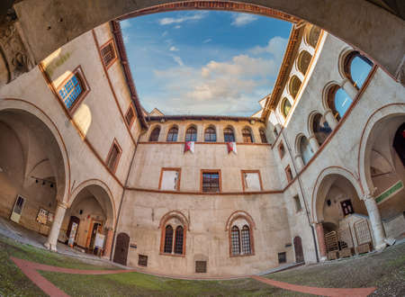 Fossano, Cuneo, Italy - December 2, 2021: courtyard medieval of castle of the Princes of Acaja (XIV century) in piazza Castello, seat of the civic library. Fish eye visionのeditorial素材