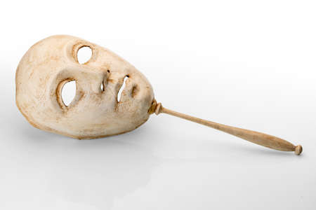 Venetian face mask with stick used for carnival and theater isolated on white background, copy spaceの写真素材