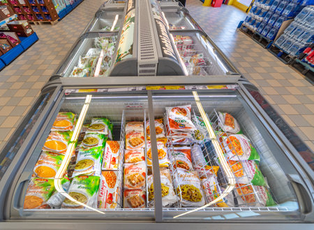 Fossano, Italy - October 29, 2021: refrigerated counters with frozen ready meals inside Eurospin discount supermarket. It is an Italian company distribution of the discount channelのeditorial素材