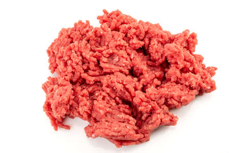Beef mince meat isolated on white, raw minced meat in close-up in top view