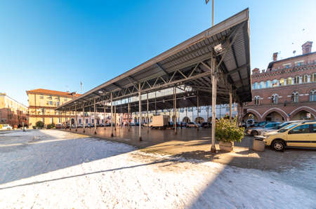 Cuneo, Piedmont, Italy - December 11, 2021: Covered vegetable and fruit market, metal canopy from...