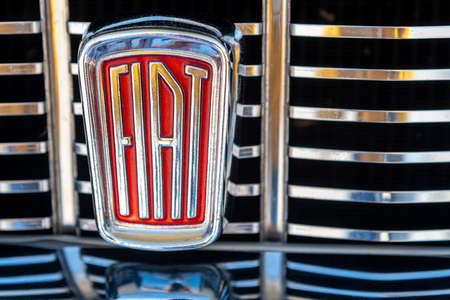 Benevagienna, Cuneo, Italy - April 10, 2016: close up of vintage Fiat brand logo on auto Fiat 1500...