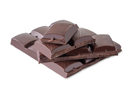 Stack of dark chocolate bar pieces isolated on white with clipping pathの写真素材