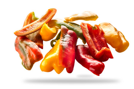 Sliced yellow green and red raw peppers isolated on white with clipping path includedの写真素材