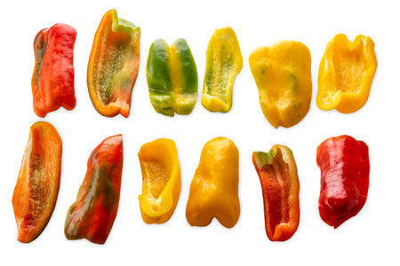 Sliced yellow green and red raw peppers isolated on white with clipping path includedの写真素材