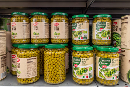 Italy - June 22, 2023: peas in glass jars produced in Italy by Selex on the shelf in Italian supermarketsのeditorial素材