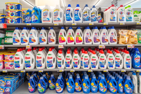 Italy - July 06, 2023: Washing machine detergents in plastic bottles of different types and brands...