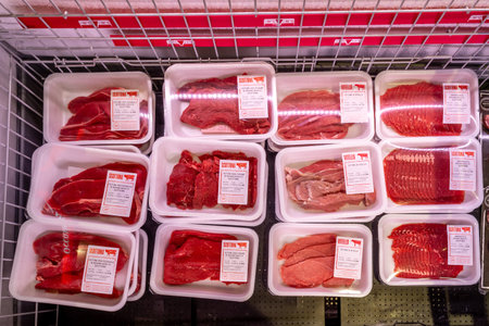 Italy - September 26, 2023: Beef steaks of various types and cuts packaged in refrigerated counter for sale in Italian supermarketのeditorial素材