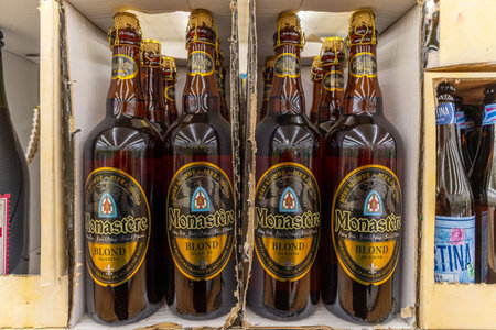 Italy - Oct. 25, 2023: bottles of Monastere beer, Dutch blond abbey beer on sale in Italian discount storeのeditorial素材