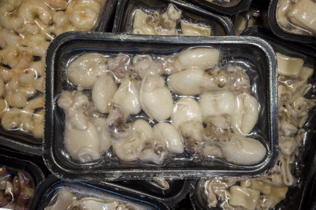 Little cuttlefish cuttlefish in vacuum trays sealed for sous vide cooking for sale in supermarket...