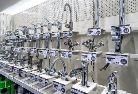 Italy - November 15, 2023: washbasin faucets displayed for sale in DIY store plumbing parts Departmentのeditorial素材