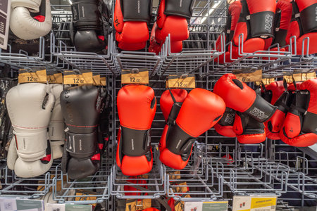 Italy - November 15, 2023: Boxing gloves displayed on shelves for sale in Italian Decathlon storeのeditorial素材