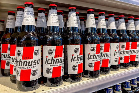 Italy - January 11, 2024: Ichnusa beer in glass bottle on shelves for sale in Italian supermarket. Beer brewed in Sardinia, Italy, for more than a centuryのeditorial素材