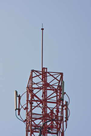 Mobile phone communication repeater antenna tower in blue sky