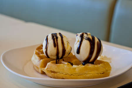 Homestyle waffles with ice cream chocolateの写真素材