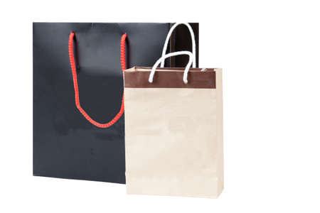 Small brown bag and black shopping bag, isolated on white backgroundの写真素材