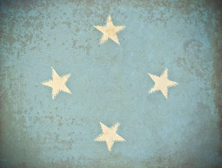 old grunge paper with Micronesia flag backgroundの写真素材