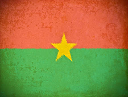 old grunge paper with Burkina Faso flag backgroundの写真素材