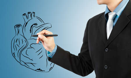 businessman drawing heart diagramの写真素材