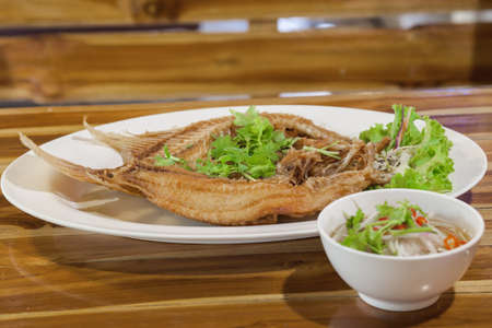 fired fish with fishsauce, thai foodの写真素材