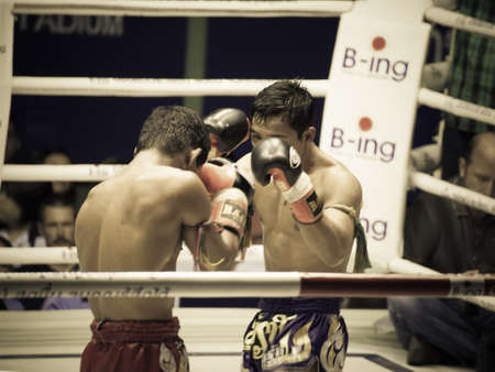 BANGKOK, THAILAND- OCTOBER 04 : Unidentified boxers compete in Thai Fight: Muay Thai Charity on October 04, 2012 at Rajadamnern Stadium in Bangkok, Thailandのeditorial素材