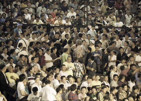 BANGKOK, THAILAND- OCTOBER 04 : Unidentified people crowd come to see boxers compete in Thai Fight: Muay Thai Charity on October 04, 2012 at Rajadamnern Stadium in Bangkok, Thailandのeditorial素材