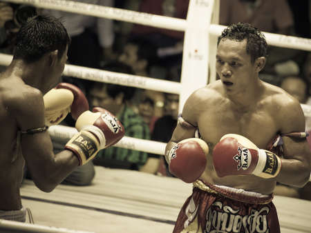 BANGKOK, THAILAND- OCTOBER 04 : Unidentified boxers compete in Thai Fight: Muay Thai Charity on...