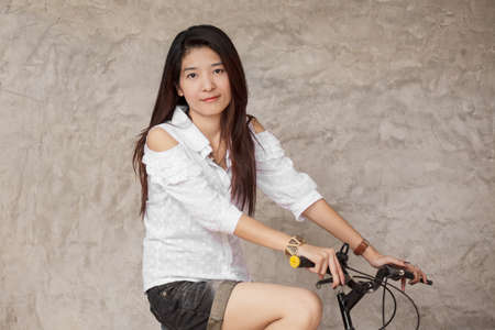 young woman with bicycleの写真素材