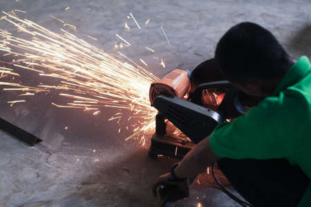 worker cutting steel and sparkの写真素材