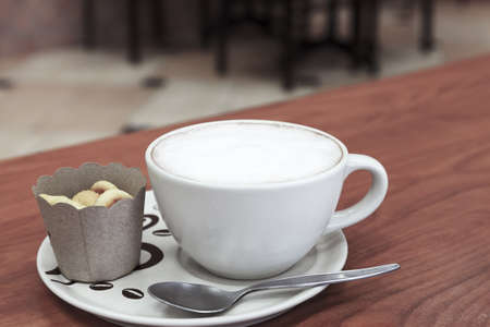 Coffee cup and bread on tableの写真素材