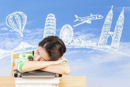Asian woman dreaming about travel and holidayの写真素材