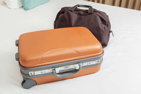 business suitcase on bed for traveling