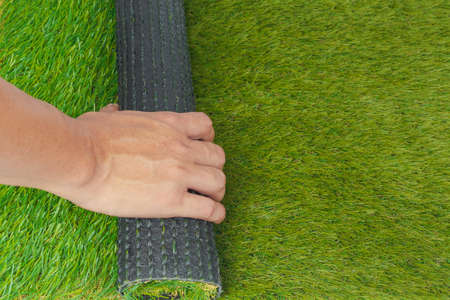 Artificial turf green grass roll with handの写真素材