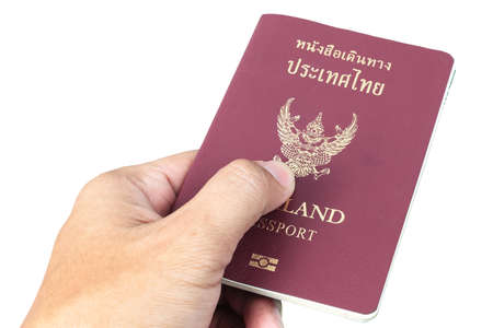 Thailand Passport and hand on white backgroundの写真素材