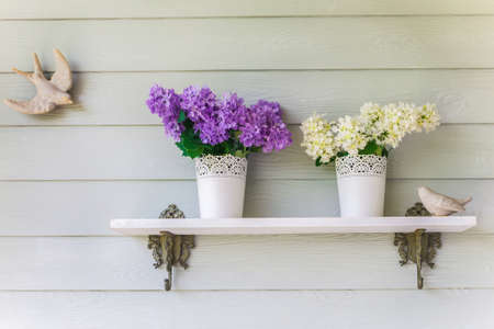 colorful flowers in pots vintage on wallの写真素材