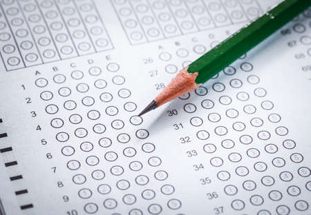 Exam carbon paper computer sheet and pencilの写真素材