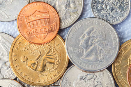 Group of US American coins and one cent on topの写真素材